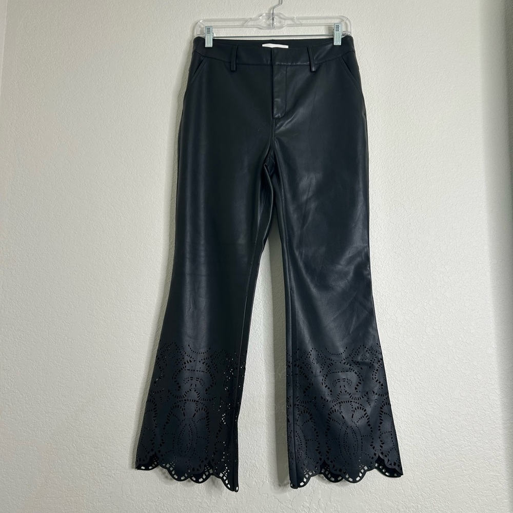Anthropologie black faux leather cut out pants